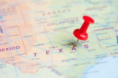 Image of map with thumb pin on the state of Texas