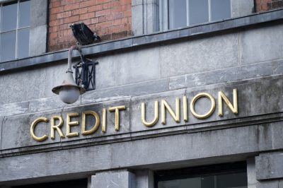 Credit Union sign on stone wall building
