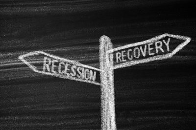 Street sign with recession and recovery